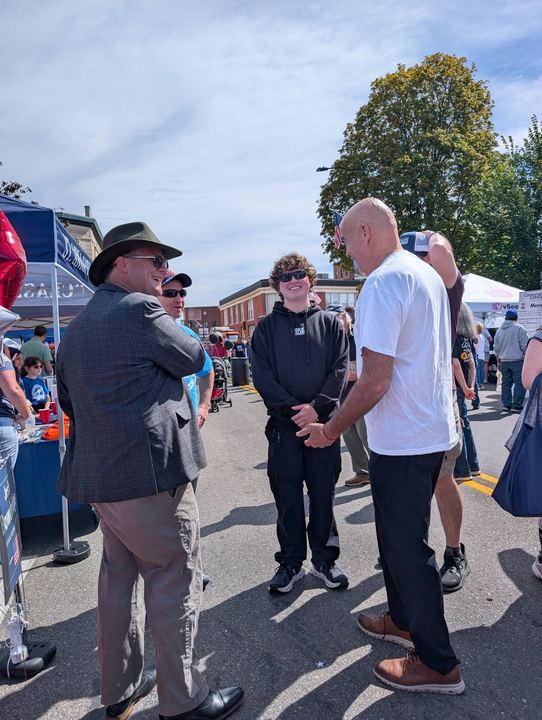 Josh talking with neighbors at a downtown Leominster street festival