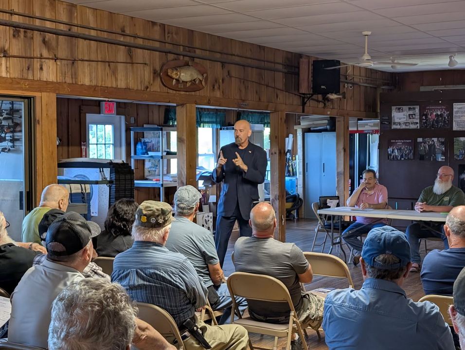 Josh speaking to residents at a community meeting